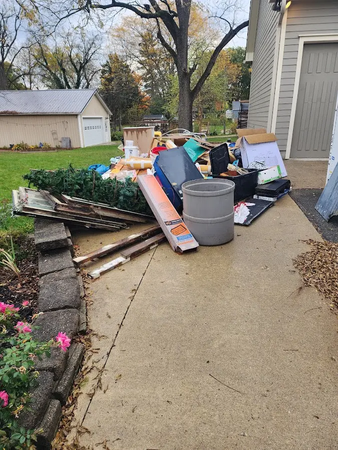 Dumpster being loaded with debris for Estate Cleanout Dumpster Rental in Elkhart
